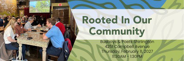 banner graphic with dark green background for a luncheon at Busboys & Poets Shirlington on Thursday, February 11, 2027 on the right is green and blue abstract leaf-like background with the bold text &ldquo;Rooted In Our Community&rdquo; centered across the image. On the right a photo of people sitting at tables with plates and glasses in front of them, with a colorful illuminated screen in the background depicting trees.